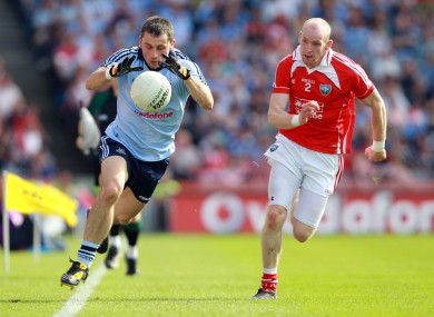 Alan Brogan tries to get away from Louth's Eamonn McAuley during the sides' meeting in 2010.