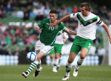 Republic of Ireland's Robbie Keane and Gareth McAuley of Northern Ireland during the Carling Nations Cup in Dublin last summer.
