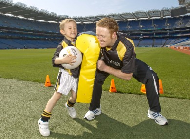 Colm Cooper squares up to four-year-old Derry Finlay at the launch of Opel's Kit for Clubs scheme earlier this week.