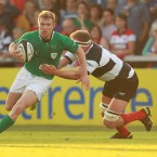 Ireland's Keith Earls tackled by Mick O'Driscoll. 