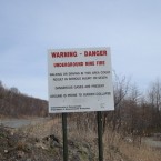 Near the highway, a sign warns of the dangers ahead. (Image: Flickr/Max Edmands)