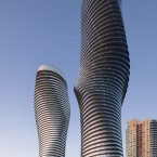 Dubbed the “Marilyn Monroe” building, due to its sexy curves, Absolute Towers has added a new landmark to the skyline of Mississauga, the fast-growing suburb of Toronto. The architects sought to add to something “naturalistic, delicate and human in contrast to the backdrop of listless, boxy buildings.” The design features smooth, unbroken balconies that wrap each floor of the building. The torsional form of the towers is underpinned with a surprisingly simple and inexpensive structural solution.

(©TomArban) Architect: MAD Architects 
