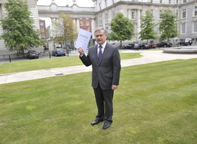 Brendan Howlin holds a copy of the first progress report on the Croke Park Agreement