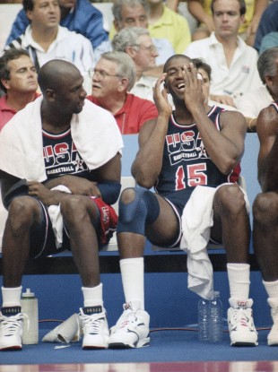 Magic Johnson, right, laughs heartily as Michael Jordan jokes during the Barcelona Olympics.