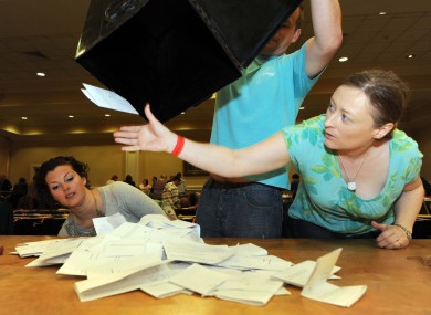 Aoife Sheridan catches a stray vote as boxes are opened at the Dublin City count centre in City West.