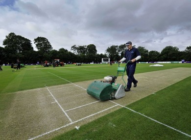 Ground staff get the Stormont crease ready (file photo).