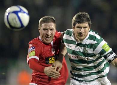 Philly Hughes challenges Ken Oman during the sides' meeting in Tallaght.