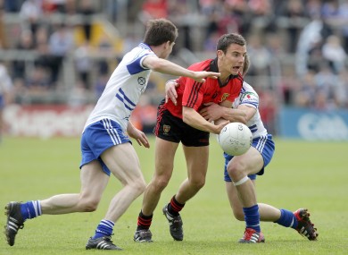 Down's Daniel Hughes with Karl O'Connell and James Turley of Monaghan.