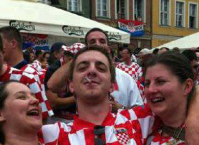 Shirts off for the Boys in Green: Jelena and Viktorija were also snapped with a Croatian fan in Poznan's main square.