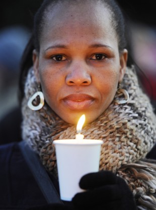 A supporters of the Justice for the Undocumented Campaign at a candlelit march, Dec 2011