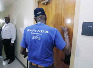 A tenant patrol volunteer makes a well-being check on a tenant at The Chicago Housing Authority's Apartamentos Las Americas