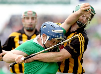 Limerick's Richie McCarthy battling with Kilkenny's Henry Shefflin.