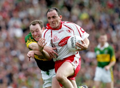 Brian Dooher accelerates past Seamus Moynihan in the 2005 final.