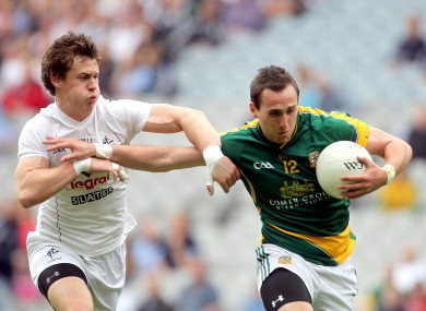 Meath's Graham Reilly and Emmet Bolton of Kildare in action.