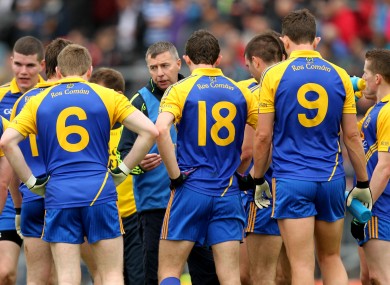 Roscommon manager Des Newton speaks to his team on the field at half-time of their tie with Armagh.