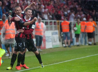 Martin Mikovic is congratulated by Michal Habanek after scoring.