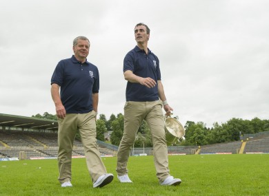 Donegal manager Jim McGuinness walks across the pitch with the Anglo Celt Cup after the game yesterday.