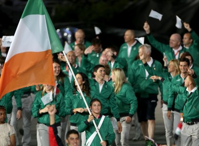 Katie Taylor leads the Irish team in the arena.