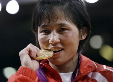 North Korea's An Kum Ae celebrates taking gold in her judo category.