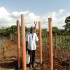 John building the stand for the water tank