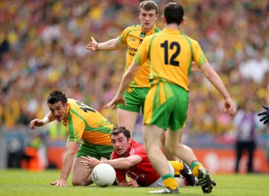 Cork's Donncha O'Connor under pressure from Leo McLoone, David Walsh and Mark McHugh of Donegal.