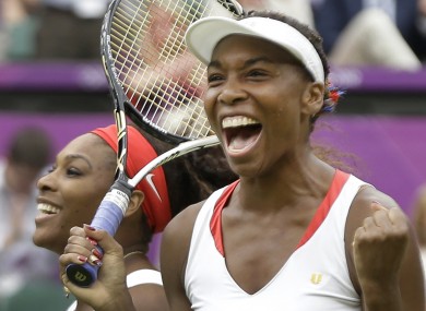 Venus Williams, right, and Serena Williams of the United States celebrate their victory against Andrea Hlavackova and Lucie Hradecka of the Czech Republic during the gold medal women's doubles match.