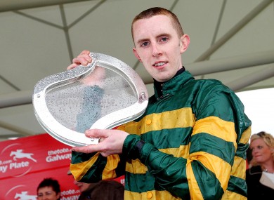 Mark Walsh with the Galway Plate after winning on Bob Lingo at the Galway Festival yesterday.