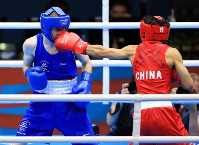 reland's Paddy Barnes (Blue) in action against Shiming Zou (Red) of China.