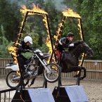 Cpl Daniel Hale races against Lce Cpl of Horse Josh Tate (right) as they jump through fire-hoops at the launch the British Military Tournament in Hyde Park, London.