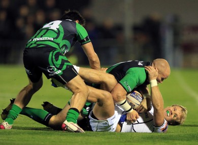 Connacht's Johnny O'Connor and Tiernan O'Halloran tackle Fionn Carr of Leinster.