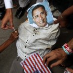 Supporters of a Insaf Student Federation burn an effigy of US President Barack Obama. (AP Photo/Fareed Khan)