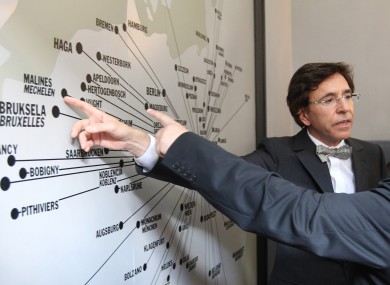 Belgium's Prime Minister Elio Di Rupo points at a map from where in Europe Jews were transported, at the former Nazi death camp of Auschwitz in Oswiecim, southern Poland