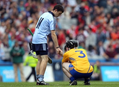 Dublin's Sean Tracy shakes hands with Brian Carey of Clare following the All-Ireland MHC semi-final.