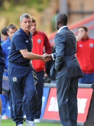 Black shakes hands with Charlton boss Chris Powell after yesterday's draw.