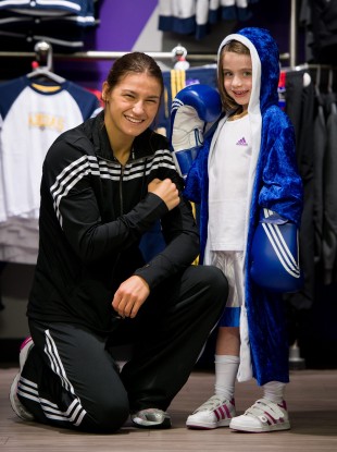 adidas ambassador Katie Taylor, pictured with Alice Brannigan, 6, during a visit to the newly refitted Life Style Sports store at Dundrum Town Centre