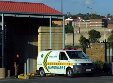 An ambulance leaves Johannesburg's central prison after an explosion near the prison.