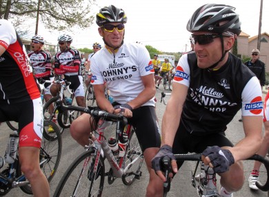 Cyclists Lance Armstrong, centre, and Levi Leipheimer, right.