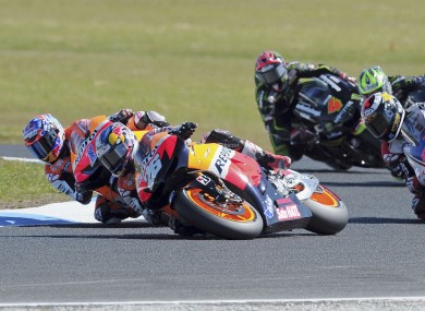 Dani Pedrosa, center front, of Spain begins to slide before a crash on turn 4 in front of teammate Casey Stoner of Australia, left, and Jorge Lorenzo of Spain, right, at the Australian MotoGP Grand Prix on Phillip Island.