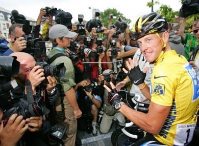 Lance Armstrong in front of the world's press after his final Tour win.