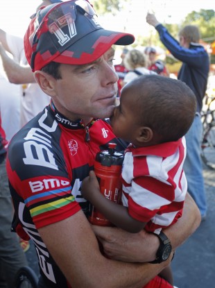 Cadel Evans holds his son Robel in Paris after the Tour finish this summer.