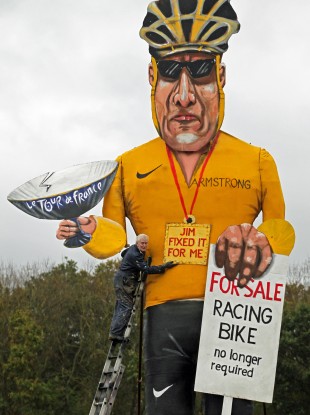 Artist Frank Shepherd puts the final touches to his creation of Lance Armstrong.