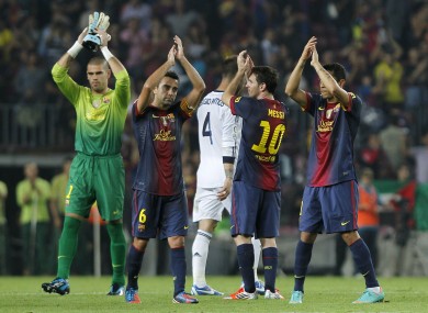 The Barcelona players applaud fans at the final whistle tonight.