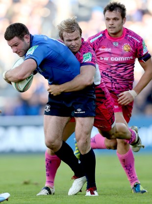 Leinster's Fergus McFadden tackled by Jason Shoemark of Exeter.