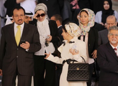 Bahrani medics leaving a trial session appealing security court convictions and sentences against them