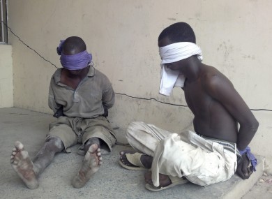 File photo of two suspected members of the Boko Haram group. Attacks by that group are thought to have prompted this morning's mosque shootings.