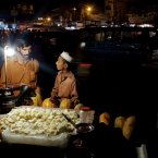 A Pakistani fruit vendor sells melon in downtown of Rawalpindi, Pakistan. (AP Photo/B.K. Bangash)