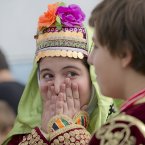 A girl wearing a traditional costume reacts in Bucharest, Romania, during celebrations of the Eid al-Adha organised by the Turkish community. The Eid al-Adha, or festival of the sacrifice, commemorates the Prophet Abraham's willingness to sacrifice his son Ishmael at God's command. Romania's Turkish minority inhabits mostly the south east of the country near the Black Sea. (AP Photo/Vadim Ghirda)