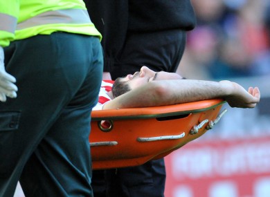 Stoke City's Marc Wilson is carried off.