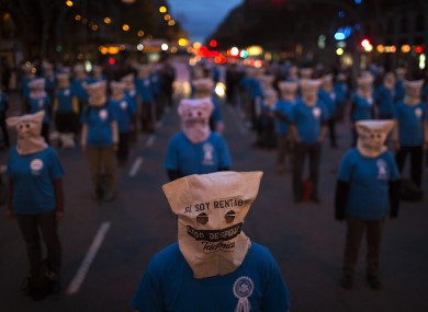 Workers from Telefonica phone company take part in a demonstration blocking the traffic and protesting against the unjustified dismissals at their company ahead of a general strike in Barcelona.