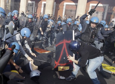 Police clash with demonstrators during a protest against Italian Government austerity measures in Rome, Wednesday, Nov. 14, 2012.